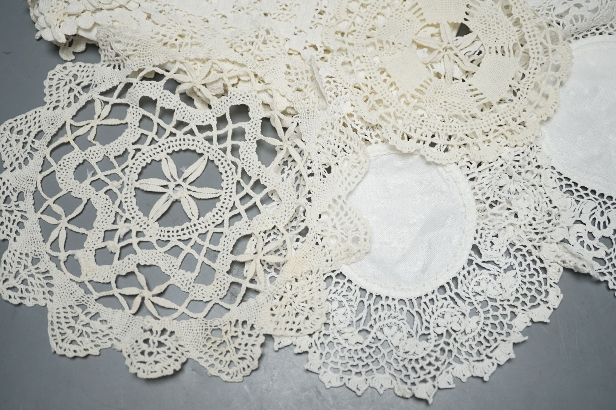 A quantity of mixed crochet, embroidered and cut work table linens.